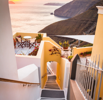 Loungers facing a mountain valley at dawn